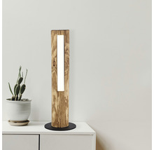 Lampadaire en bois avec éclairage intégré sur une table