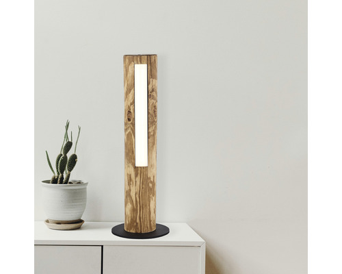 Lampadaire en bois avec éclairage intégré sur une table