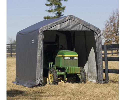 Grauer Unterstand mit einem Rasentraktor