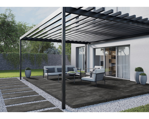 Terrasse avec pergola, mobilier de jardin et dalles en pierre