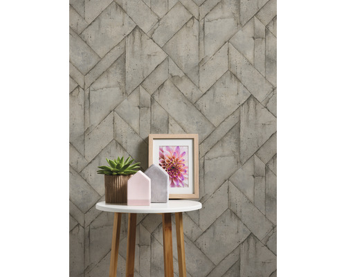 Papier peint à motif de blocs de béton sur une table avec des décorations