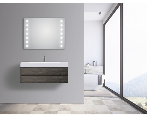 Modernes Badezimmer mit Waschtischunterschrank, Waschbecken und beleuchtetem Spiegel