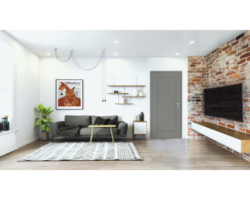 Helles Wohnzimmer mit Sofa, Teppich und Ziegelwand