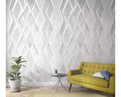 Wohnzimmer mit dreidimensionaler Diamanttapete, Sofa und Zimmerpflanze