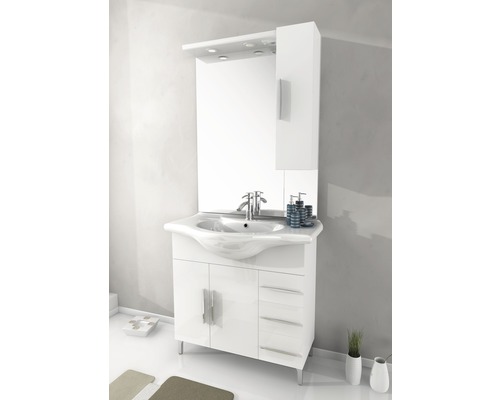 Salle de bain avec meuble-lavabo blanc, armoire de toilette et éclairage pour une atmosphère lumineuse et organisée.