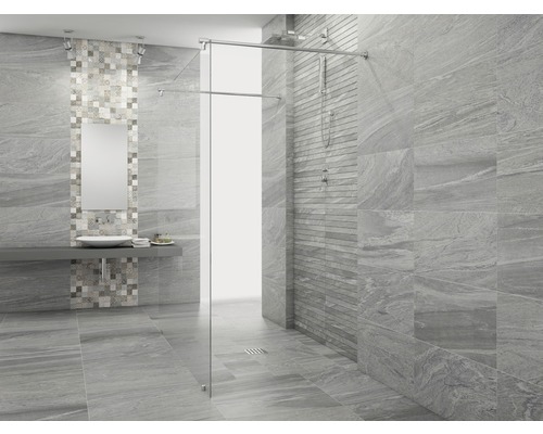 Salle de bains moderne avec carrelage gris et cabine de douche en verre.