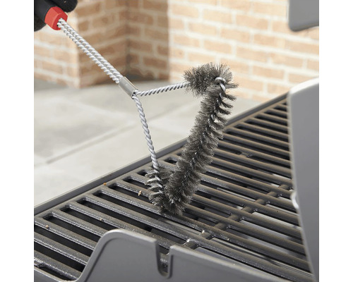 Grillbürste reinigt einen Grillrost