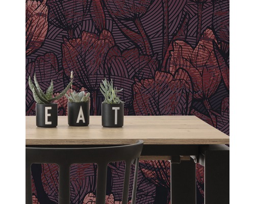 Scène avec des papiers peints à motifs et des plantes grasses sur une table