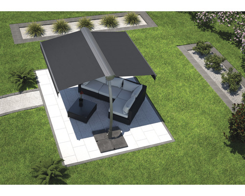 Vue de jardin avec parasol et coin salon sur une surface pavée