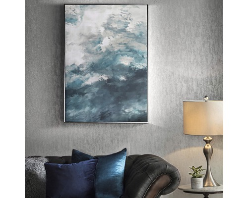 Tableau mural encadré avec motif abstrait au-dessus du canapé