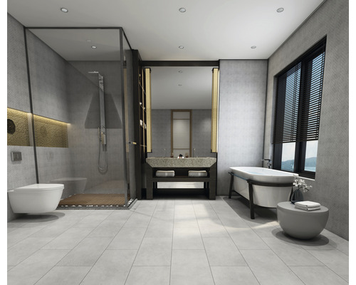 Salle de bains lumineuse avec douche, lavabo et baignoire.