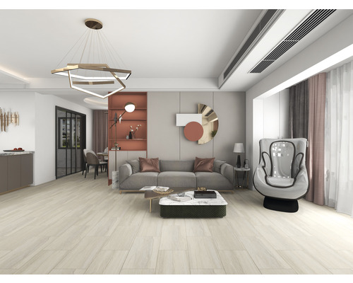 Salon lumineux avec canapé, fauteuil, table basse et suspension