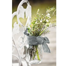 Vase à fleurs décorative avec un ruban sur un cadre métallique blanc