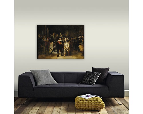 Peinture La Ronde de nuit au-dessus d''un canapé dans le salon