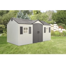 Abri de jardin avec double porte, fenêtres et volets sur pelouse