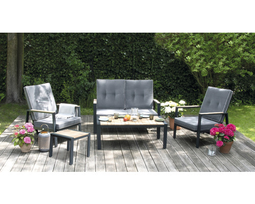 Ensemble de meubles de jardin siège à dossier haut alu bois de teck Ensemble de meubles de jardin avec deux fauteuils, un canapé et une table sur une terrasse en bois