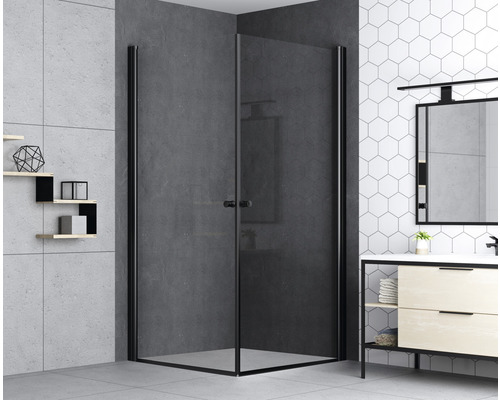 Eckdusche mit schwarzem Rahmen in einem modern gestalteten Badezimmer.