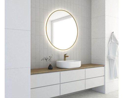 Salle de bains moderne avec miroir rond, lavabo et carreaux blancs