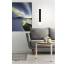 Luminaire suspendu moderne avec abat-jour cylindrique dans un salon