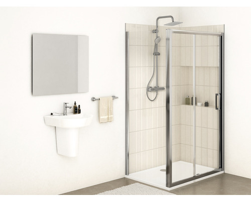 Salle de bains avec douche, lavabo, miroir et porte-serviettes pour une ambiance claire et organisée.