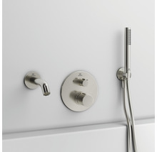 Aufputz Badearmatur mit Handbrause an einer Wand montiert