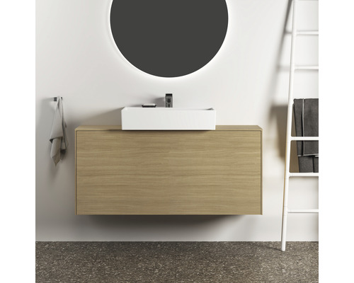 Salle de bains avec lavabo, meuble sous-lavabo et miroir rond