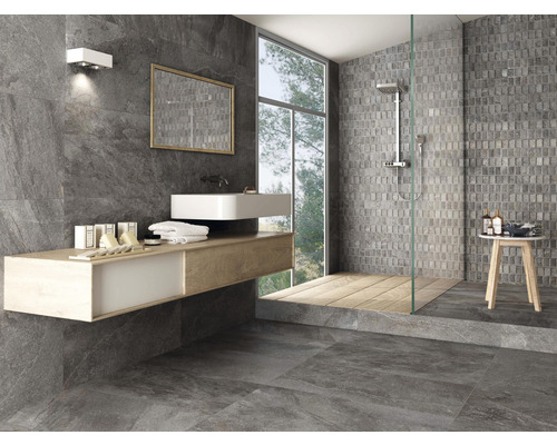 Salle de bains moderne avec carrelage gris, lavabo et douche