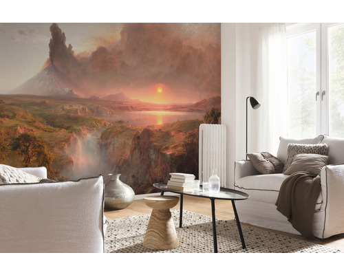 Salon avec papier peint paysage, canapés, tapis et table