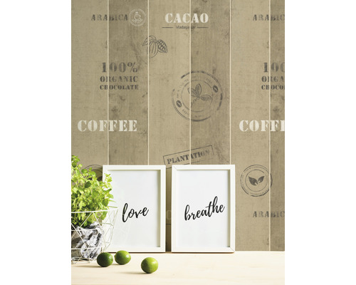 Papier peint photo décoratif avec inscriptions et motifs naturels derrière deux images encadrées avec les mots amour et respiration