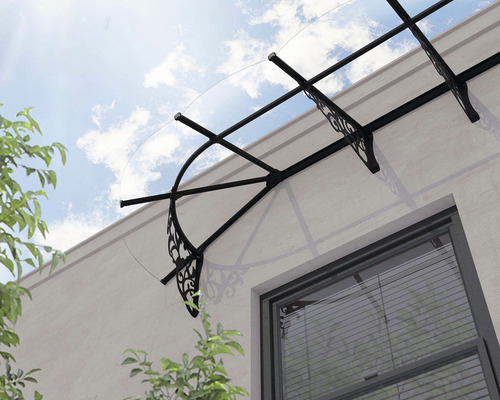 Vordach mit Stahlkonstruktion und klarer Bedachung über einem Fenster