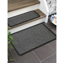 Paillasson et tapis d''escalier en matériau côtelé avec bord sombre sur l''escalier et le sol