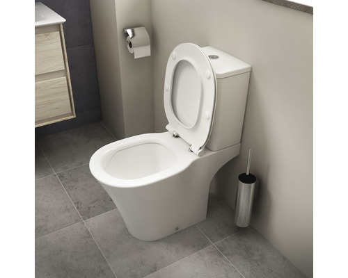 WC sur pied blanc avec couvercle ouvert dans la salle de bain