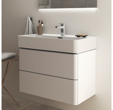 Meuble-lavabo avec deux tiroirs, robinetterie et miroir avec éclairage dans la salle de bains
