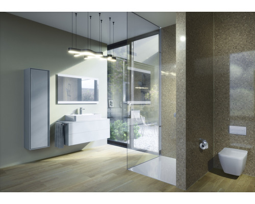 Salle de bain moderne avec lavabo, miroir, cabine de douche et toilettes.