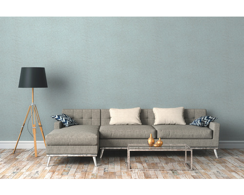 Salon avec canapé gris, lampadaire et parquet