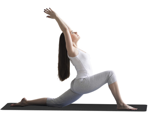 Femme faisant un exercice de yoga sur un tapis de yoga