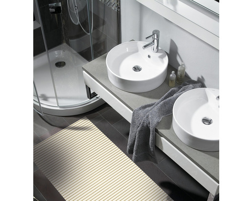 Salle de bains lumineuse avec douche, lavabo avec deux vasques à poser et tapis de bain
