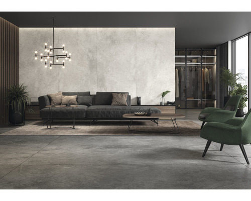 Salon moderne avec canapé, fauteuils, tapis et éclairage