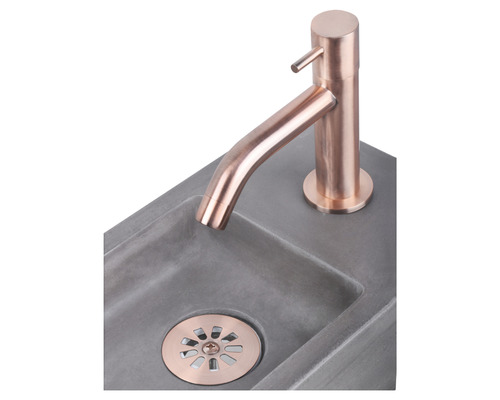 Waschbecken aus Beton mit Wasserhahn