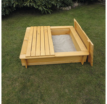 Bac à sable en bois avec couvercle dans le jardin