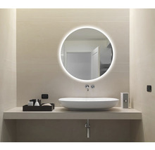 Salle de bain moderne avec miroir rond, vasque à poser et intérieur lumineux
