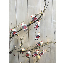 Dekorativer Weihnachtszweig mit Santa Claus Figuren und Lichtern für festliche Beleuchtung