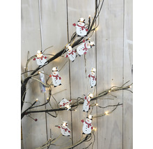 Guirlande lumineuse avec figurines de bonhommes de neige sur une branche
