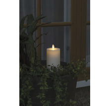 Bougie LED décorative avec des plantes dans une jardinière