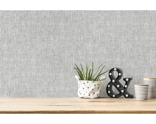 Tapete mit Textilstruktur auf einer Wand