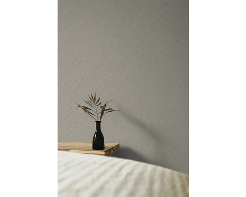 Gros plan d''un papier peint intissé gris avec un fin motif textile
