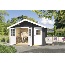 Abri de jardin avec portes doubles ouvertes, espace de travail et coin salon extérieur