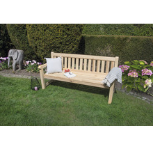 Scène de jardin avec banc en bois, coussin et décoration