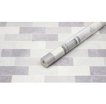 Rolle mit keramischer Wandverkleidung auf Steintapete