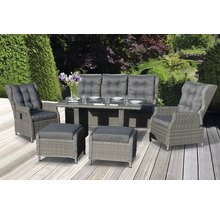 Ensemble de meubles de jardin avec table, banc, fauteuils et tabourets sur une terrasse
